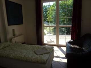 Проживание в семье Dandelion B&B Варшава Односпальная кровать в общем номере для мужчин и женщин-6